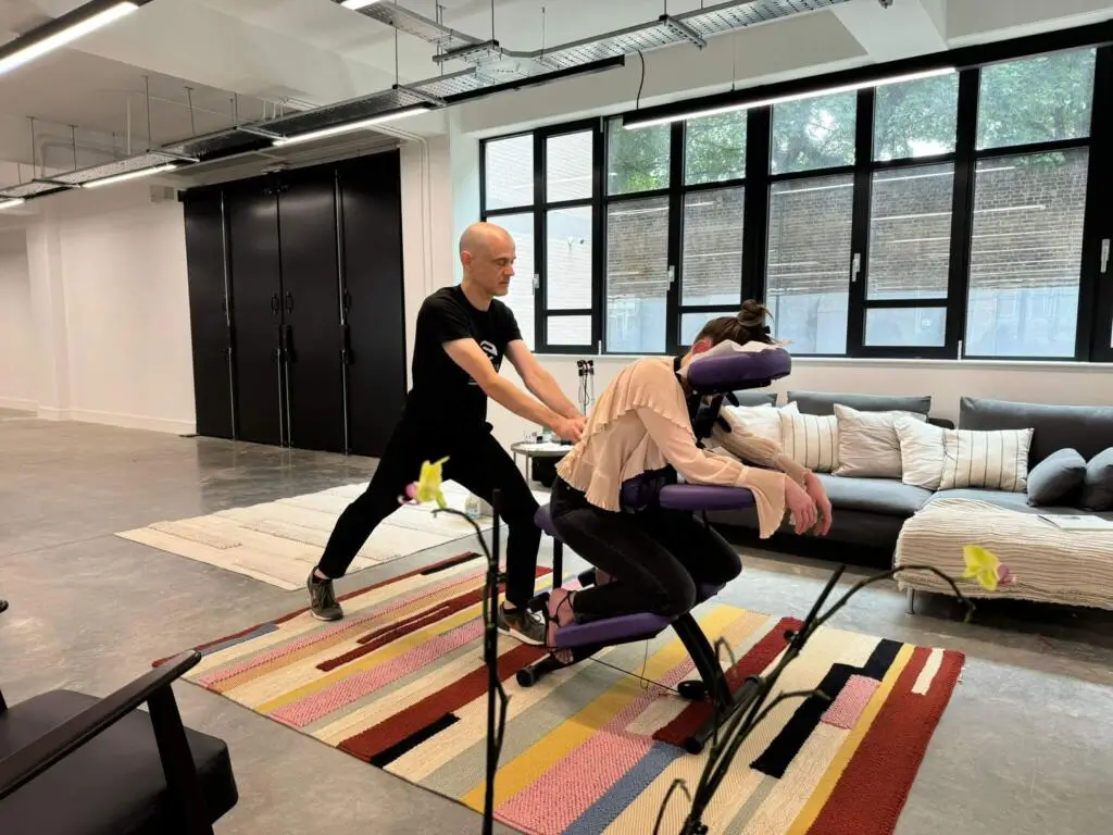 Benefits of office massage, employee enjoying massage at Vinted.